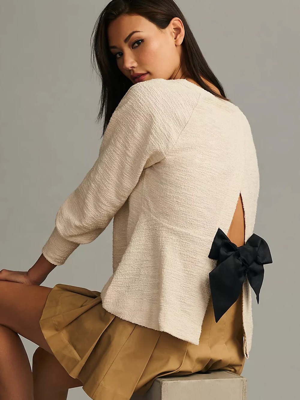 Anthropologie Back Bow Sweatshirt Top in cream with black bow - size XS